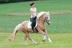 woman rides warmblood