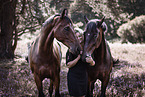 woman and 2 horses