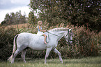 girl rides warmblood