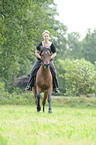 woman rides Welsh-Cob