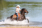 woman rides Welsh-Cob