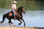 woman rides Welsh-Cob