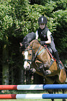 girl jumps with Welsh Pony