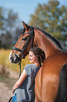 woman and Westphalian Horse