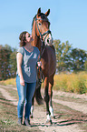 woman and Westphalian Horse