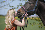 woman and Westphalian warmblood