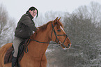 woman rides warmblood