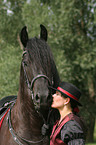 young woman with Friesian Horse