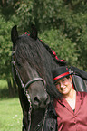 young woman with Friesian Horse