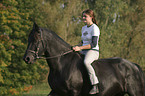 friesian with horsewoman