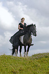 young woman riding Irish Tinker