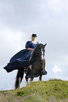young woman riding Irish Tinker