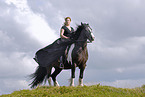 young woman riding Irish Tinker