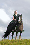 young woman riding Irish Tinker