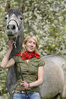 young woman with arabian horse