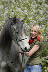 young woman with arabian horse