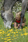 young woman with arabian horse
