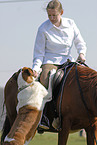 rider accompanied by dog
