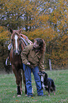 woman with horse and dog