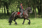 woman with friesian horse at show
