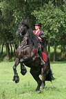 woman with friesian horse at show