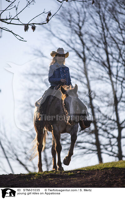 young girl rides on Appaloosa / STM-01035