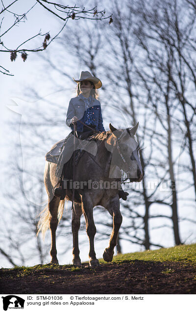 young girl rides on Appaloosa / STM-01036