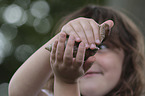 Child with African giant snail