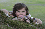 Child with African giant snail