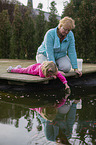 people at a Goldfish pond