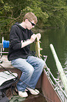 young angler with pike
