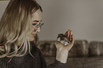 woman with dwarf Hamster