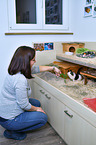 woman with Guinea Pig