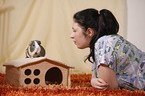 young woman with guinea pig