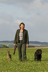 huntsman with fawn and dog